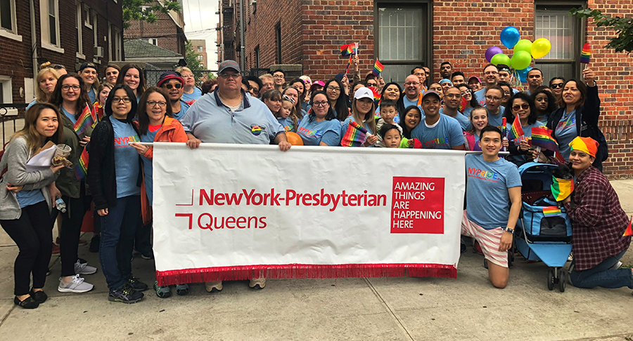 a group of people holding a sign