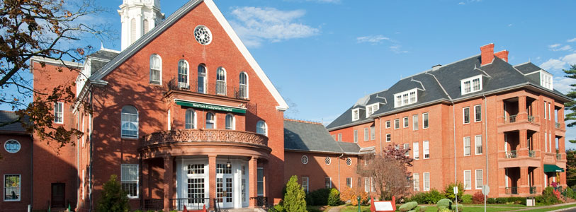 a large brick building with a clock tower