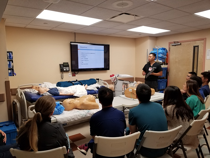 a person giving a presentation to a group of people