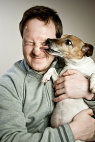 man holding dog