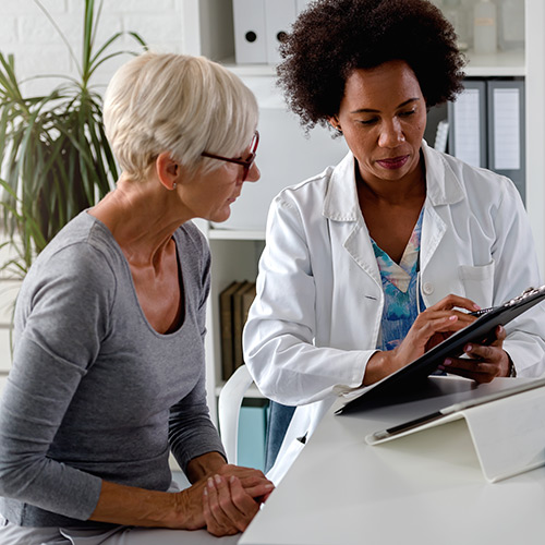 image of a female doctor speaking with a female patient