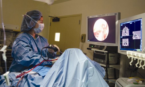 A surgeon operating in the operating room 