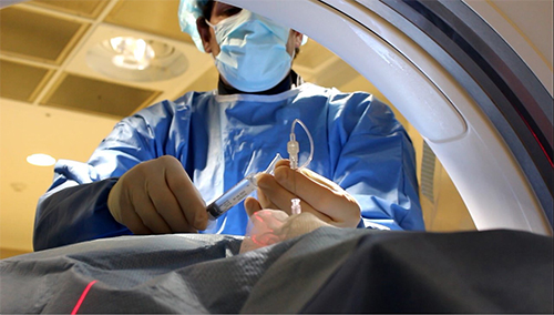 Nurse administering anesthesia