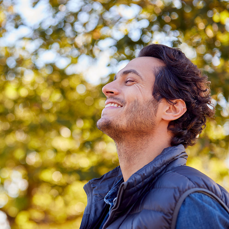 man smiling in nature