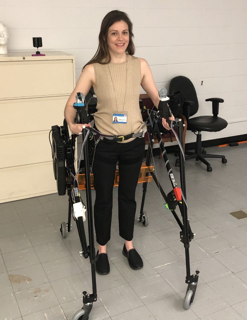 A Columbia staff member using the overground robotic gait trainer.