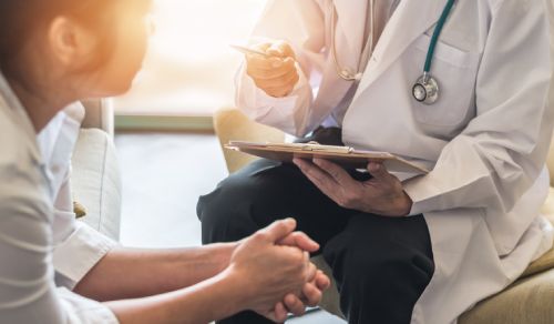 A patient speaking with a doctor