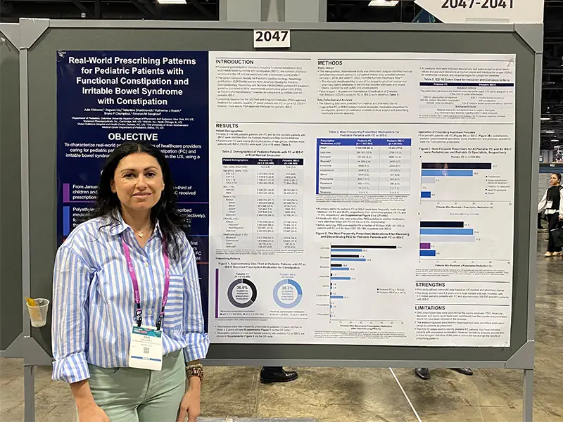 Dr. Khlevner in front of her poster board