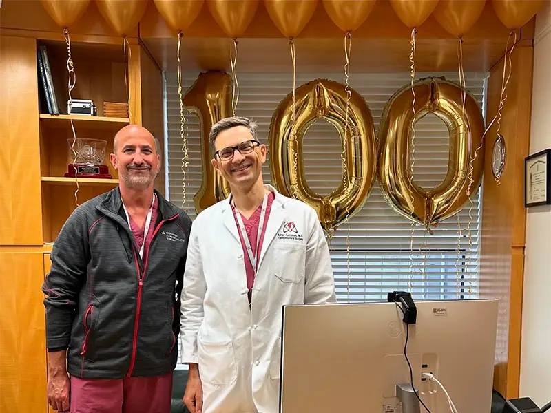 LaLonde and Dr. Geirsson in an office with balloons around