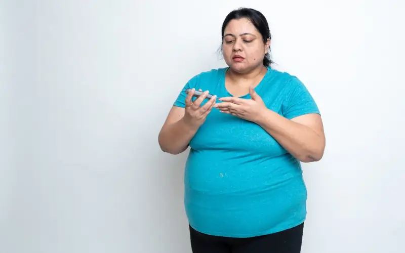 woman checking blood sugar