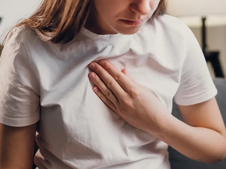 image of person clutching chest