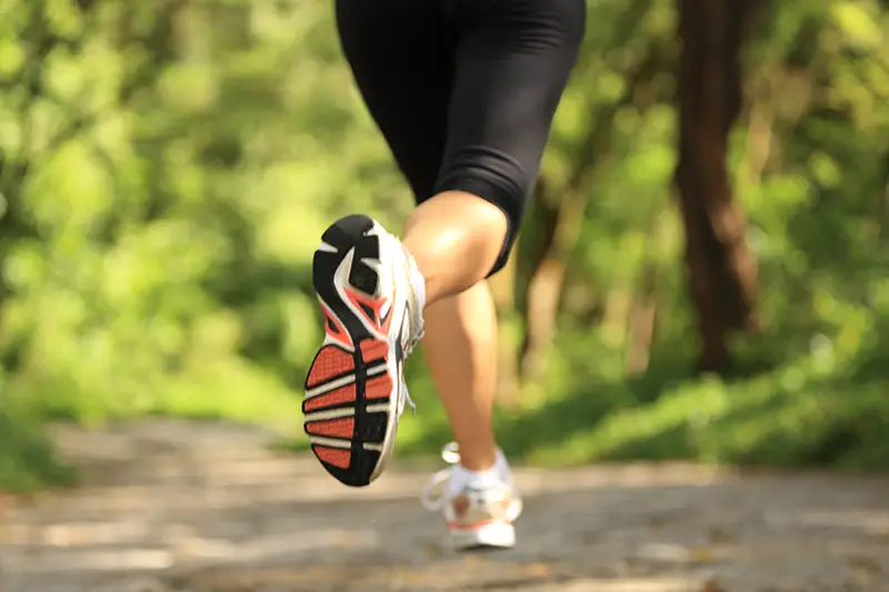 image of sneakers and person running in nature