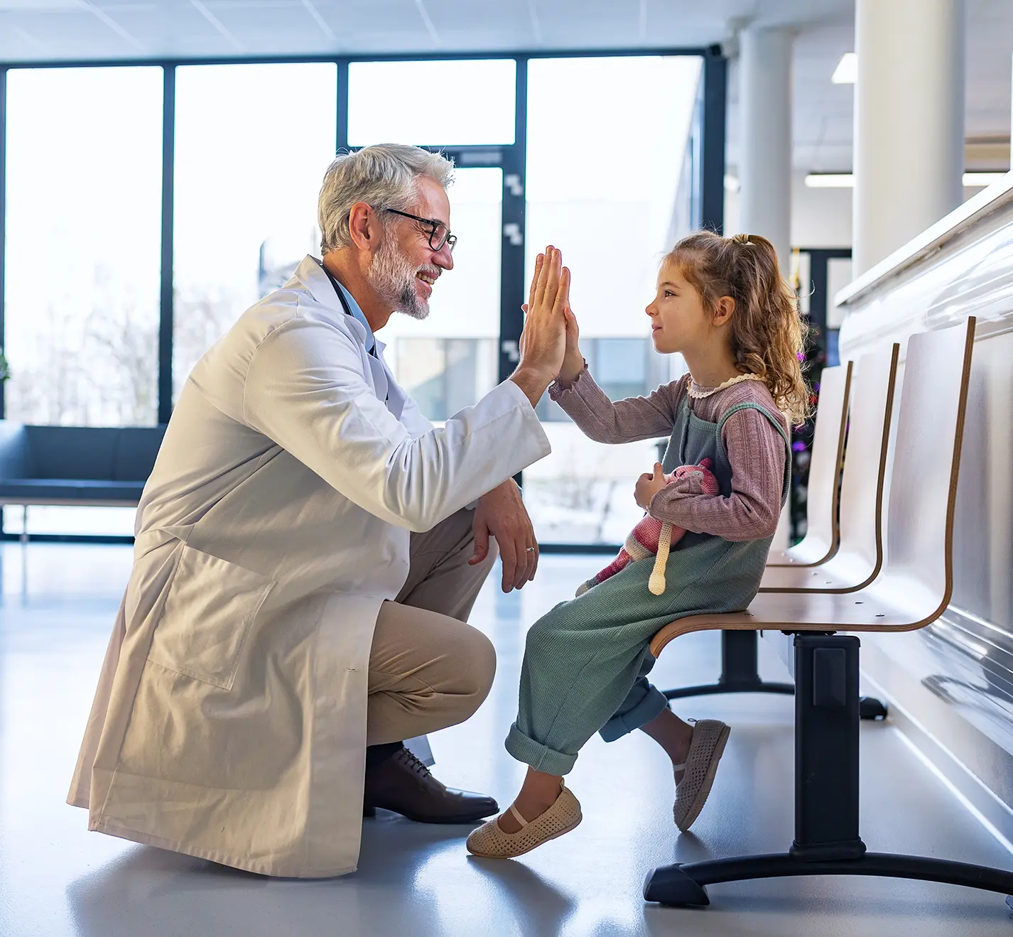 doctor high fiving a kid